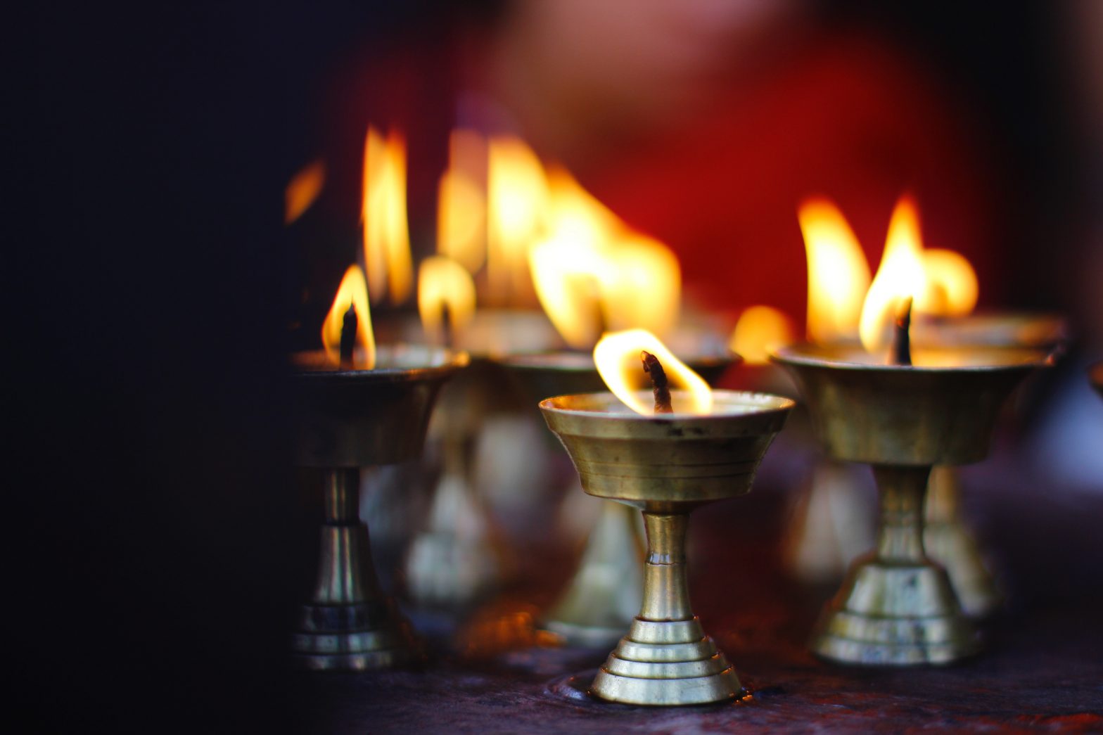 hindu candles burning by mesh